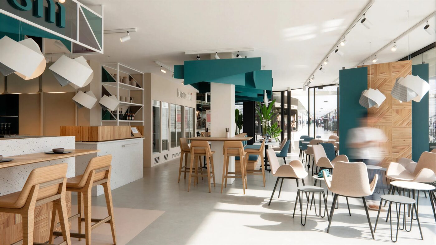 Area pranzo del ristorante TOASUSHI con tavoli rotondi e sedute dal design contemporaneo.